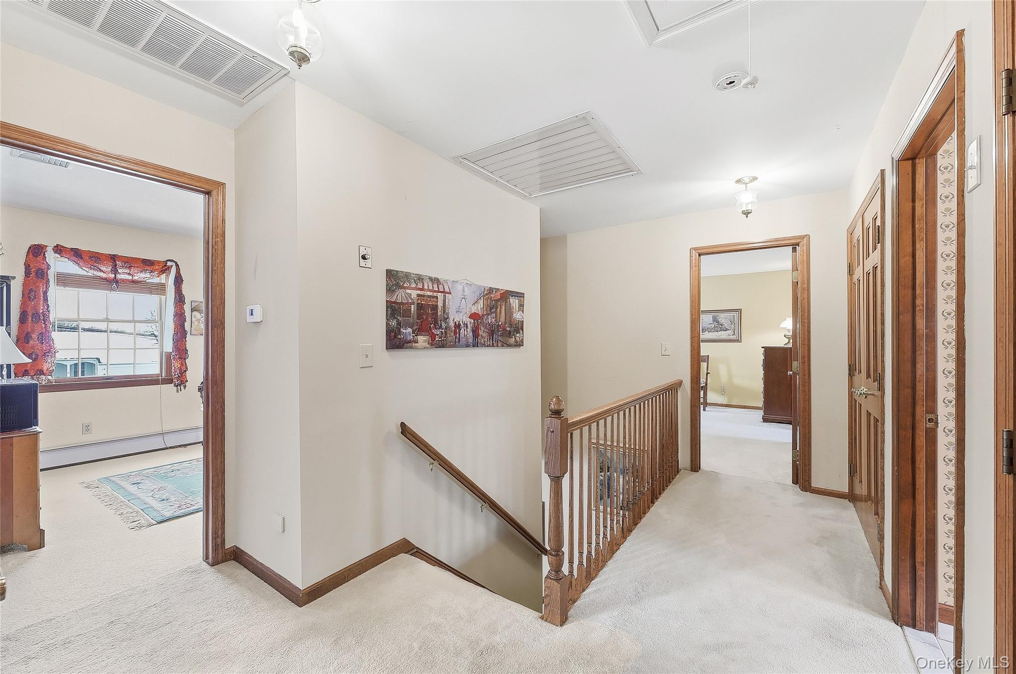 183 High Meadows Road Walden, NY 12586 - Photo 27 of 44 Hall featuring an upstairs landing, light colored carpet, baseboard heating, and attic access