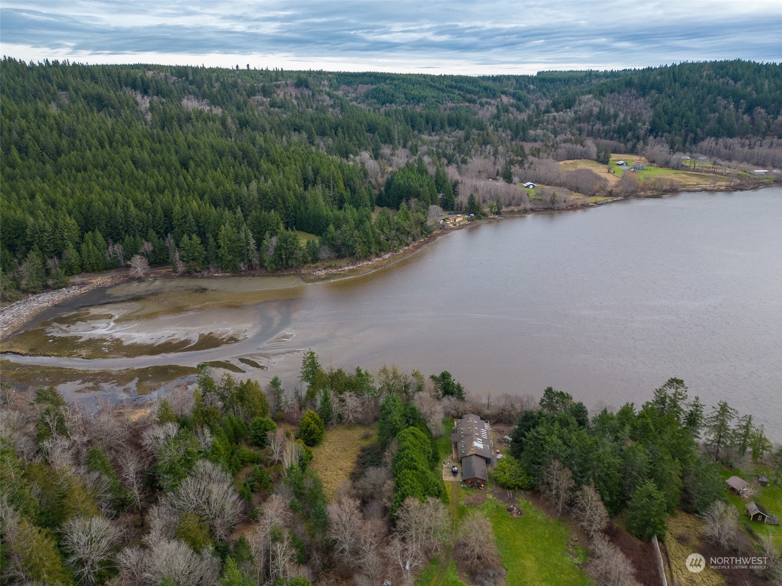 981 Carl Johnson Road Quilcene, WA 98376 - Photo 1 of 15 a view of a lake with a mountain