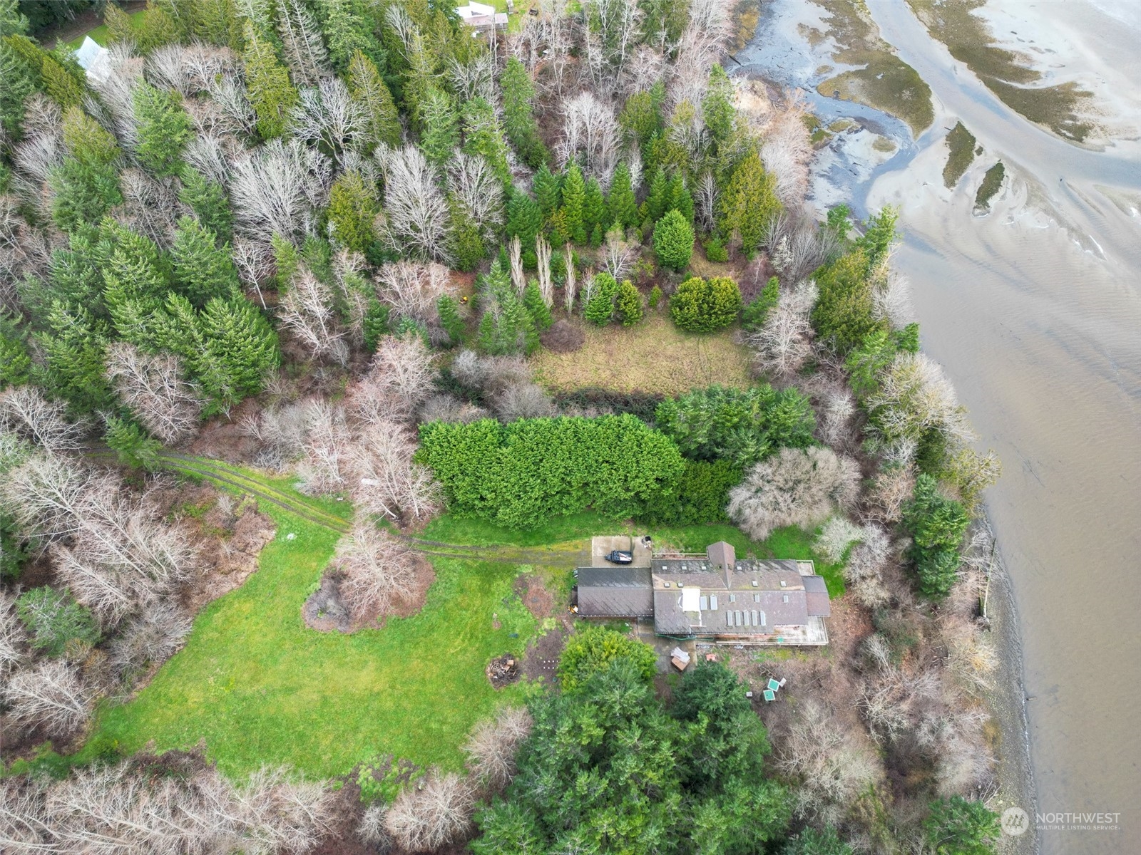 981 Carl Johnson Road Quilcene, WA 98376 - Photo 5 of 15 an aerial view of a house with a yard