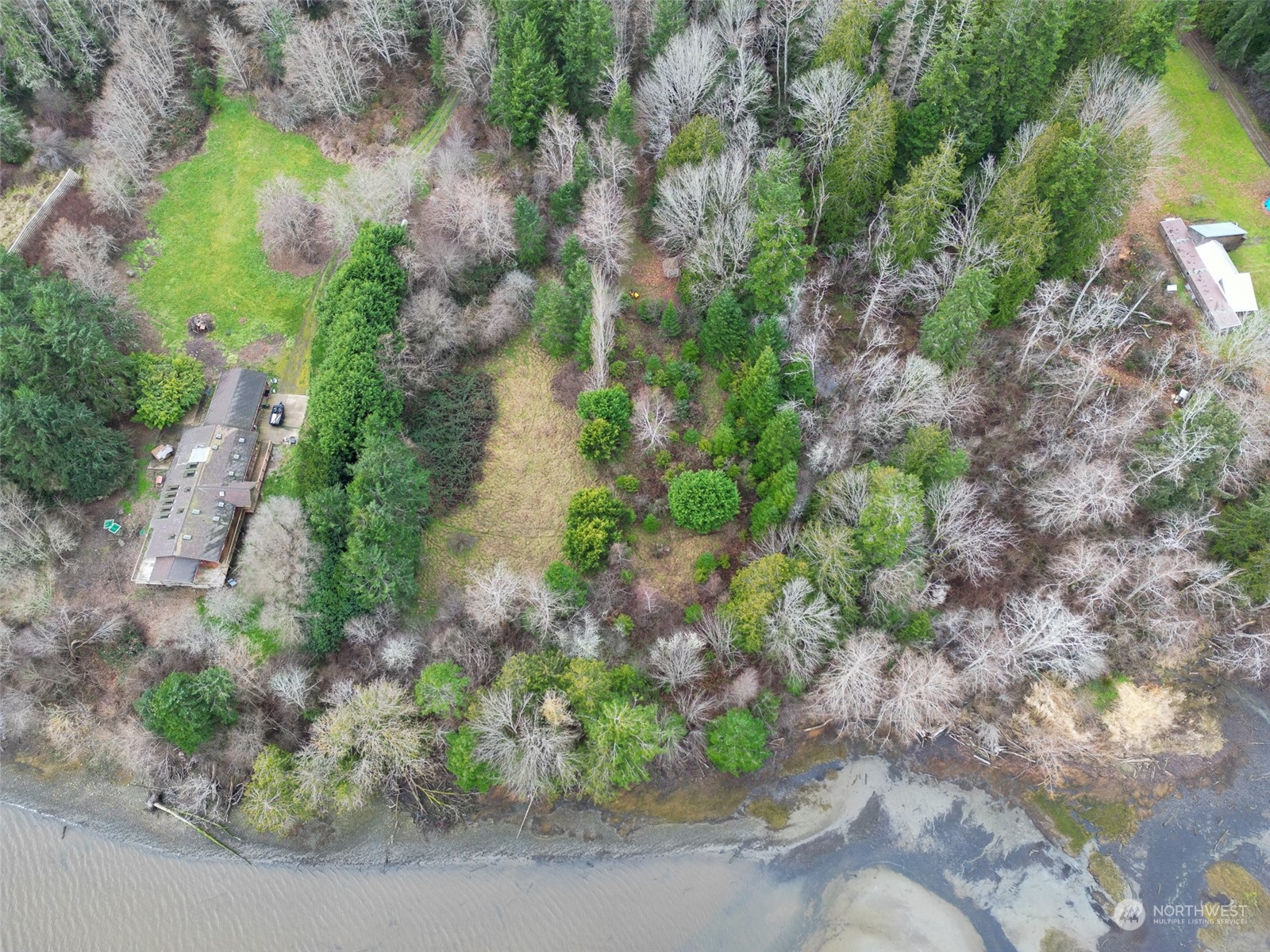 981 Carl Johnson Road Quilcene, WA 98376 - Photo 6 of 15 a backyard of a house with a yard and outdoor seating