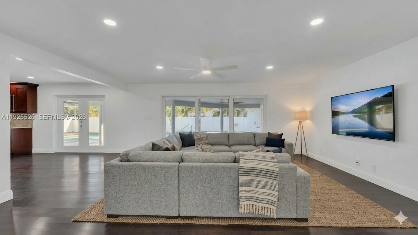 620 Northeast 2nd Street Pompano Beach, FL 33060 - Photo 14 of 53 a living room with fireplace furniture and a flat screen tv