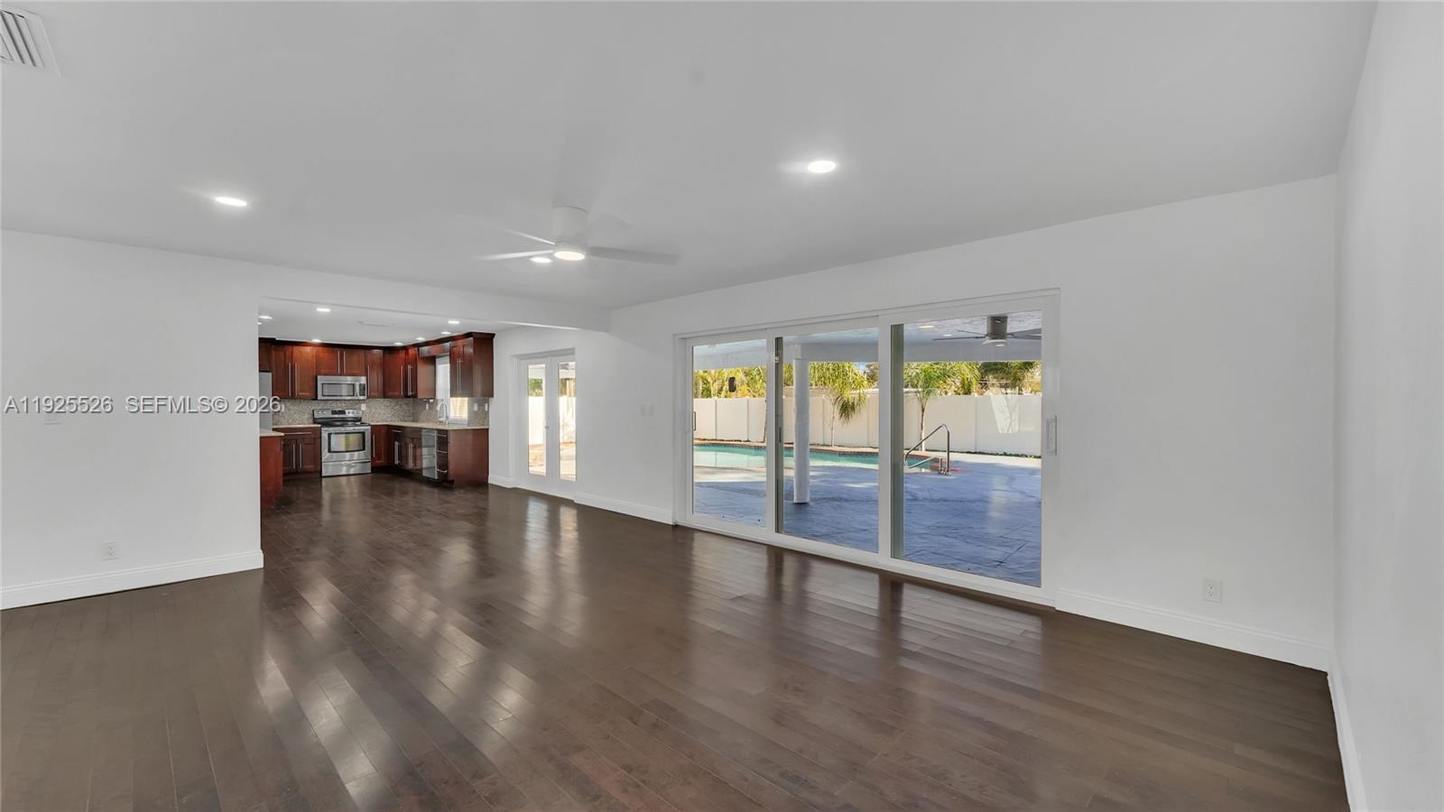 620 Northeast 2nd Street Pompano Beach, FL 33060 - Photo 15 of 53 a view of an empty room with wooden floor and a window