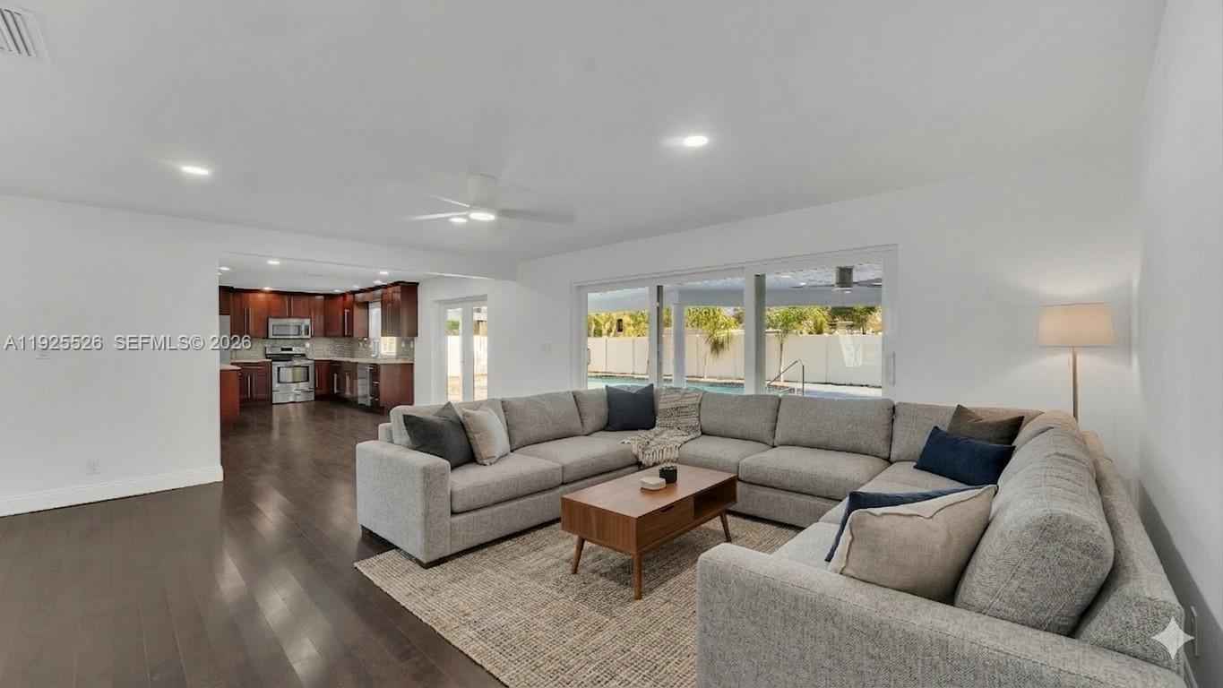 620 Northeast 2nd Street Pompano Beach, FL 33060 - Photo 16 of 53 a living room with furniture and a wooden floor