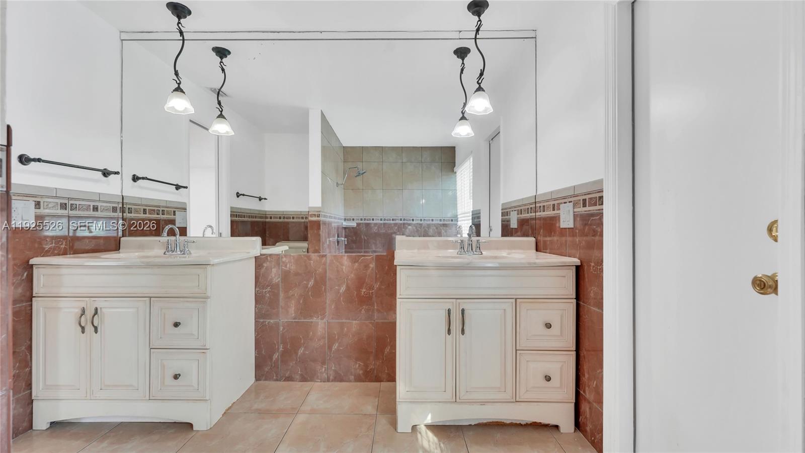 620 Northeast 2nd Street Pompano Beach, FL 33060 - Photo 28 of 53 a bathroom with a granite countertop sink a mirror and shower
