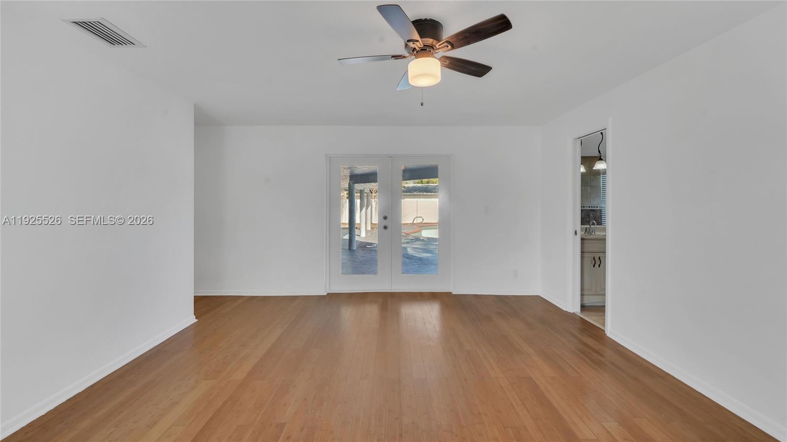 620 Northeast 2nd Street Pompano Beach, FL 33060 - Photo 32 of 53 a view of empty room with wooden floor
