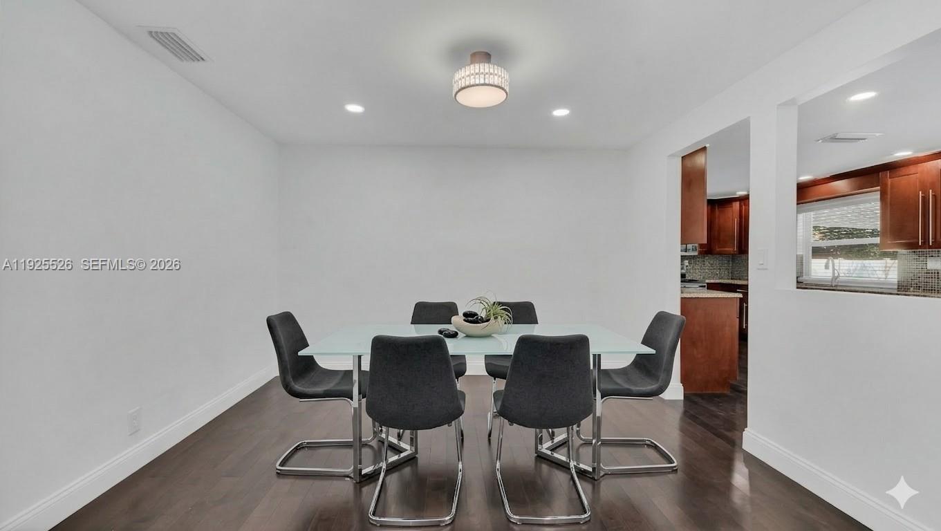 620 Northeast 2nd Street Pompano Beach, FL 33060 - Photo 7 of 53 a view of a dining room with furniture and wooden floor