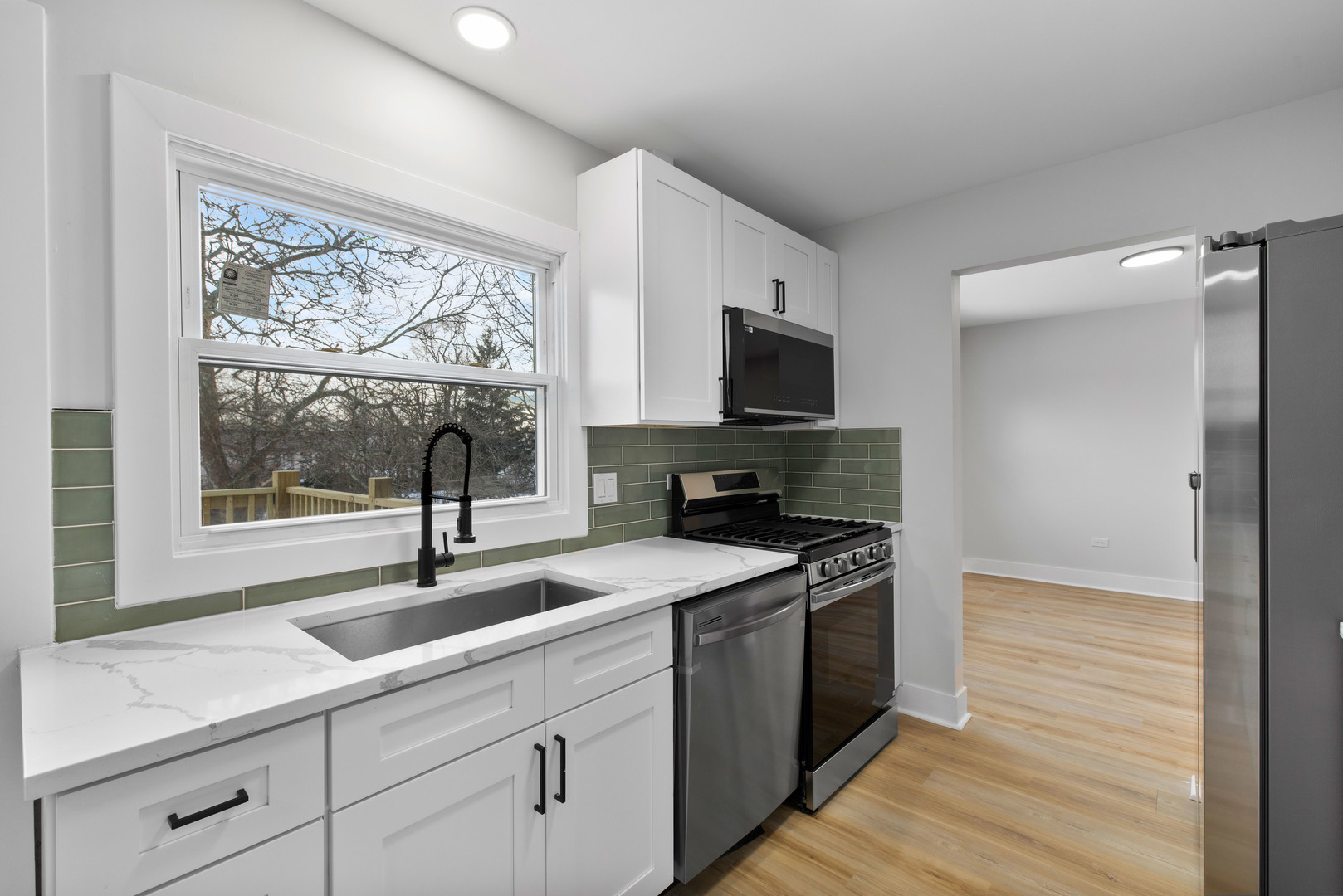523 Nathan Road University Park, IL 60484 - Photo 12 of 43 a kitchen with a sink stove and microwave