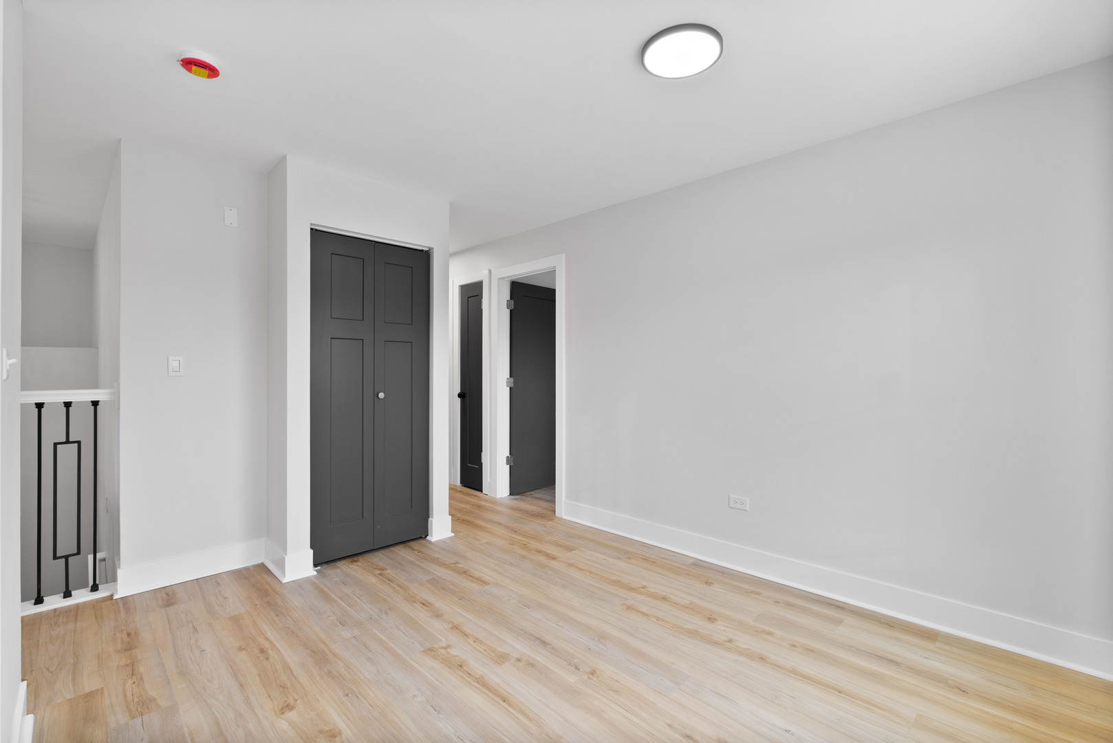 523 Nathan Road University Park, IL 60484 - Photo 16 of 43 a view of an empty room with wooden floor and a window