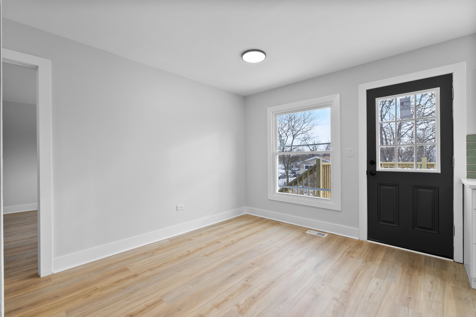 523 Nathan Road University Park, IL 60484 - Photo 17 of 43 an empty room with wooden floor and windows