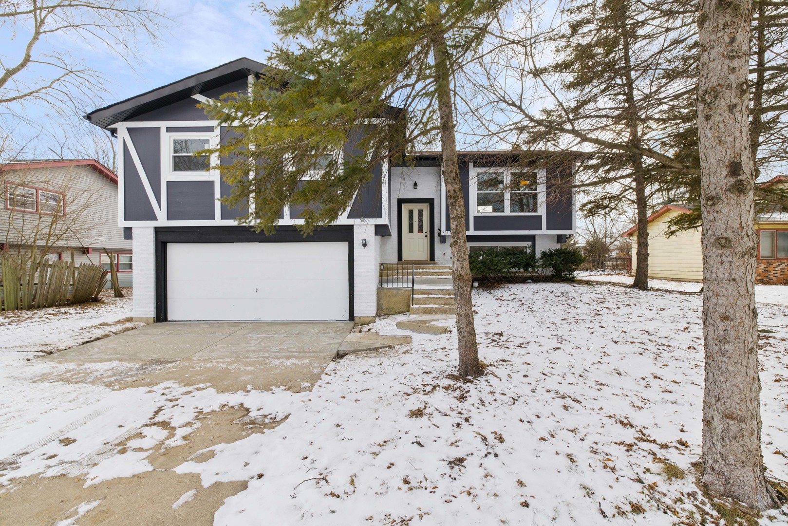 523 Nathan Road University Park, IL 60484 - Photo 2 of 43 a front view of a house with a yard covered in snow