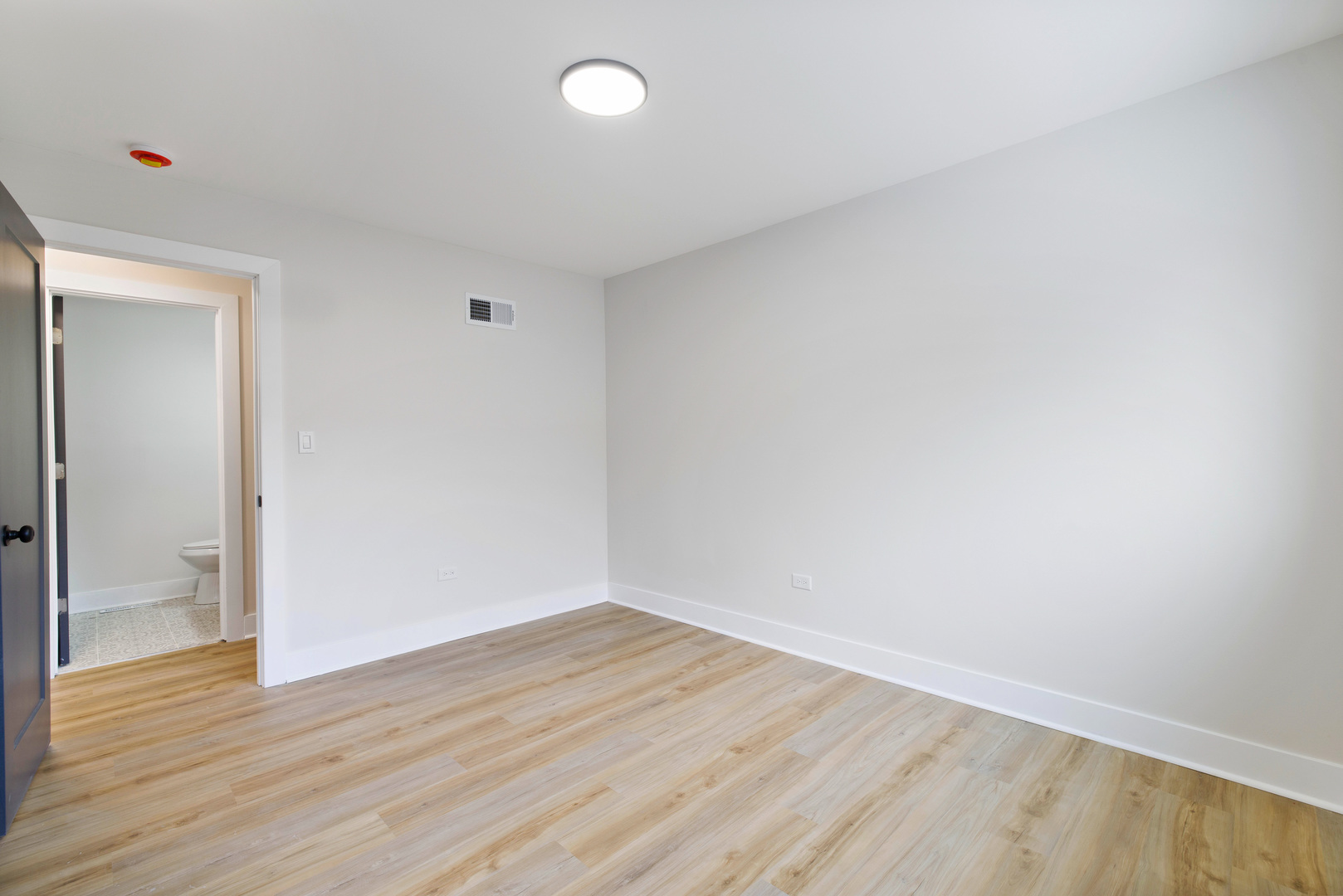 523 Nathan Road University Park, IL 60484 - Photo 24 of 43 a view of an empty room with wooden floor and a window