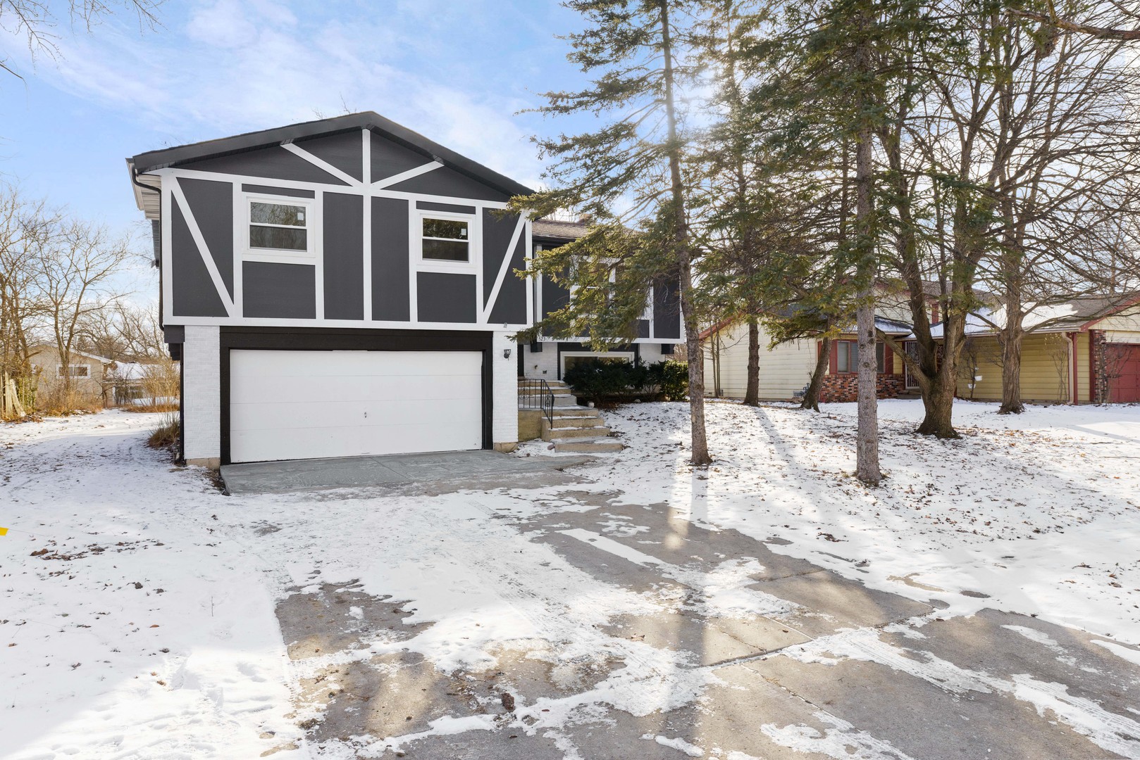 523 Nathan Road University Park, IL 60484 - Photo 3 of 43 a front view of a house with a yard covered in snow