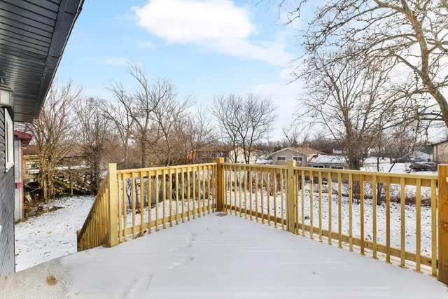 a front view of a house with a large window
