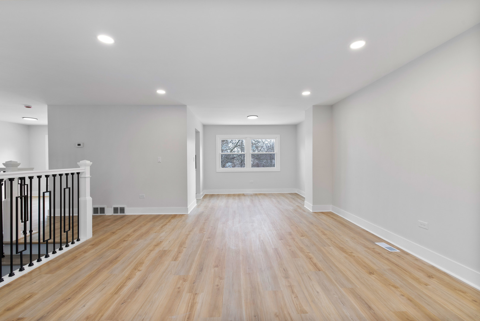 523 Nathan Road University Park, IL 60484 - Photo 5 of 43 a view of an empty room with wooden floor and a window