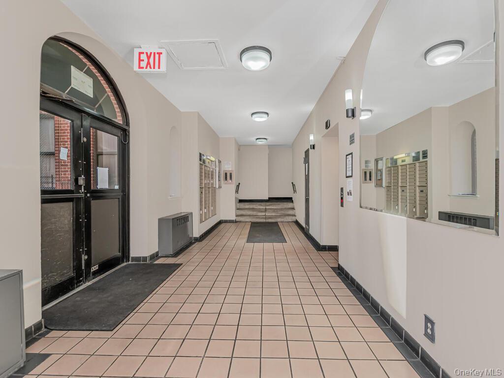 581 Academy Street, Unit GLE Manhattan, NY 10034 - Photo 12 of 18 a view of a hallway view with staircase