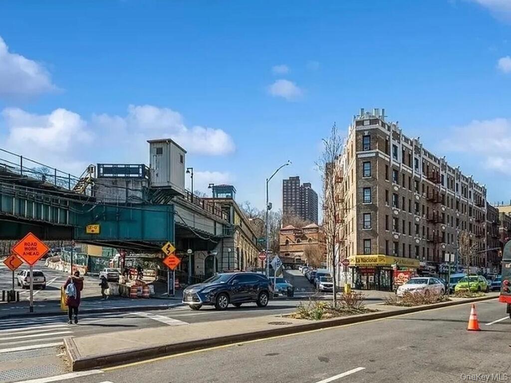 581 Academy Street, Unit GLE Manhattan, NY 10034 - Photo 16 of 18 a view of a street with cars
