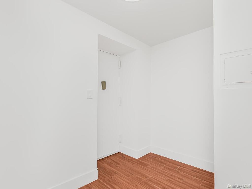 581 Academy Street, Unit GLE Manhattan, NY 10034 - Photo 9 of 18 a view of a small space with wooden floor