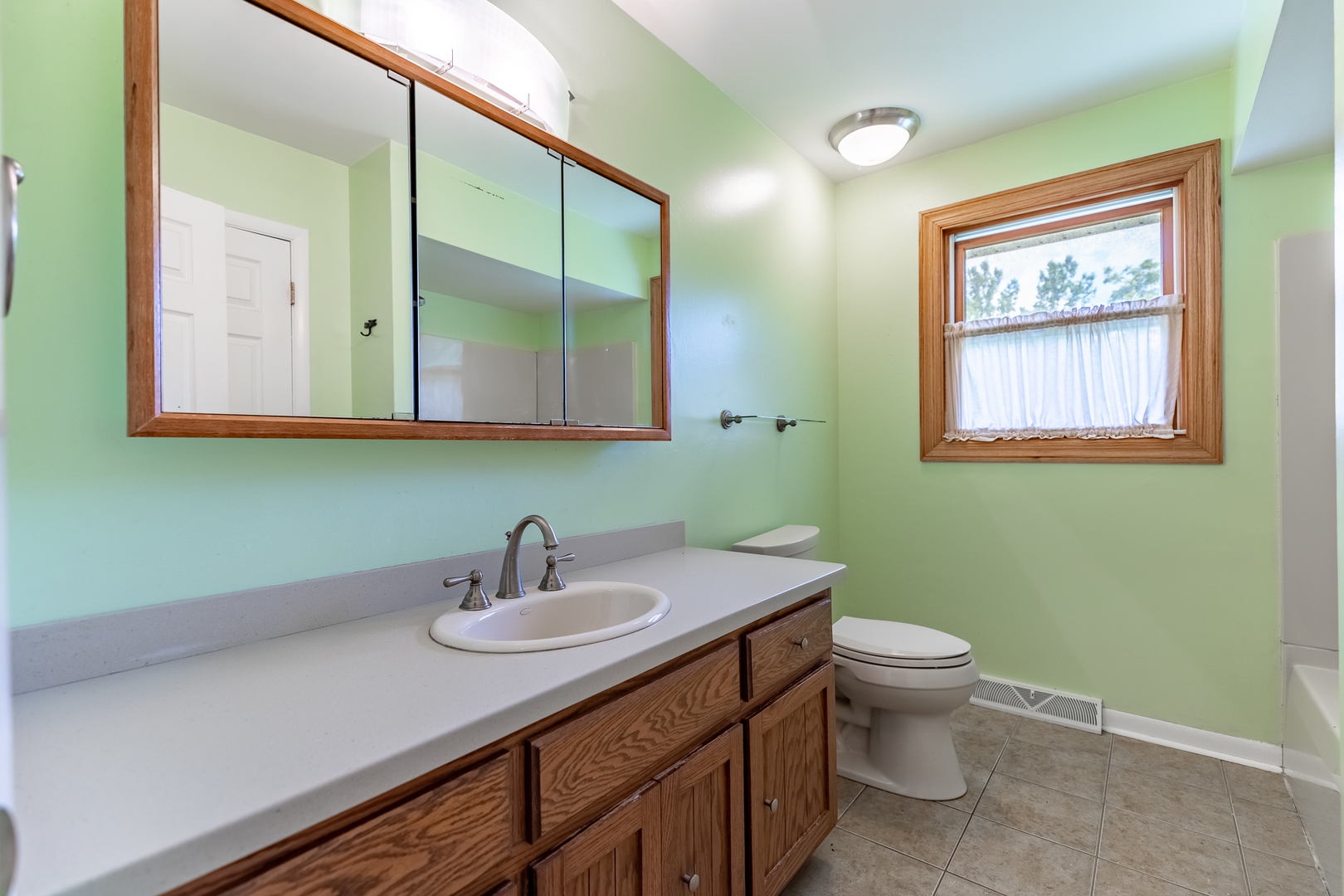11609 North Brightway Road Mokena, IL 60448 - Photo 39 of 47 a bathroom with a toilet sink and mirror