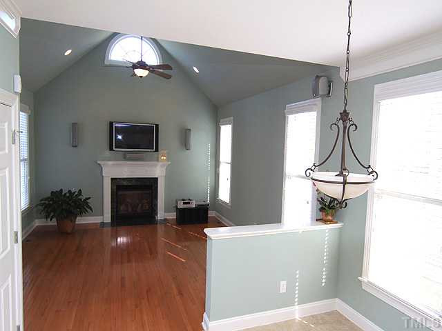 Family room has hardwoods, lots of light,ceiling fan, cathedral ceiling, sound system. Good proximity to the kitchen and the back deck. Den/Family/Great Room