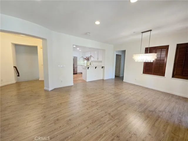 a view of a kitchen with a sink and dishwasher wooden floor