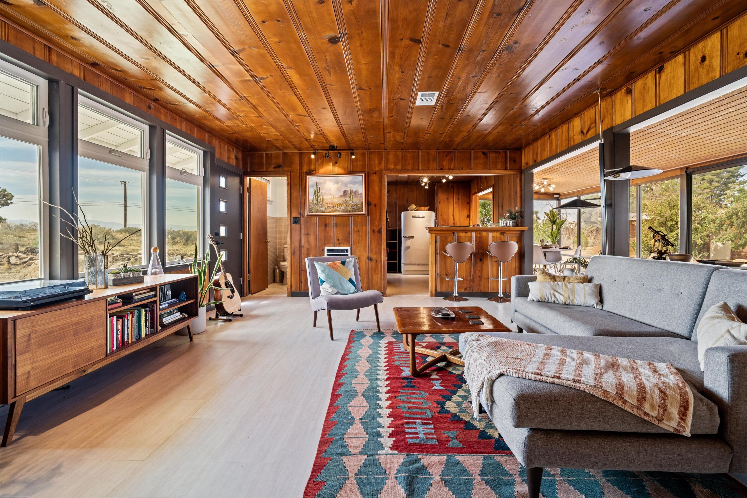 11337 Avenue E E Lancaster Ca East Lancaster, CA 93535 - Photo 13 of 60 a outdoor space with furniture and large windows