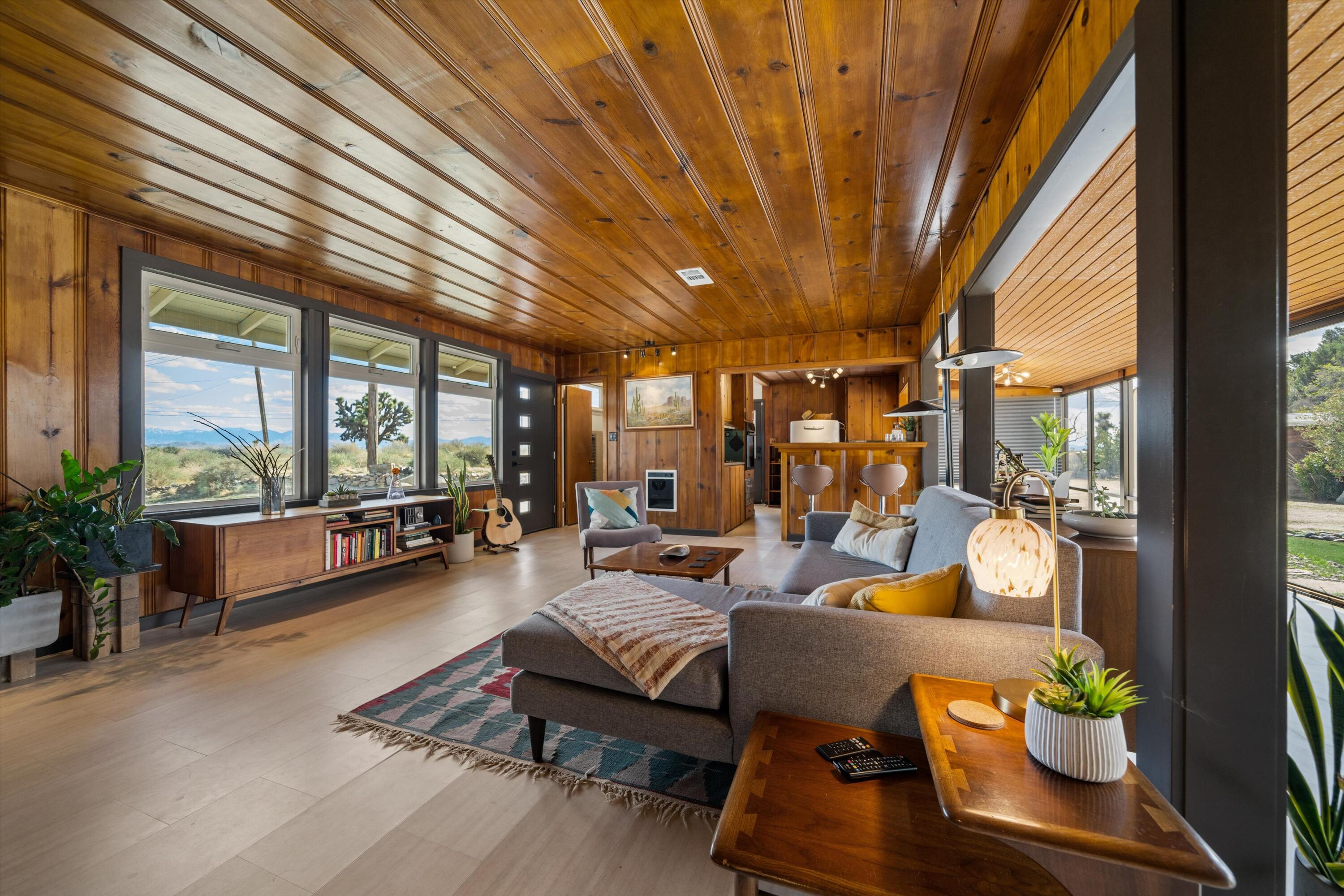11337 Avenue E E Lancaster Ca East Lancaster, CA 93535 - Photo 25 of 60 a living room with furniture and a large window