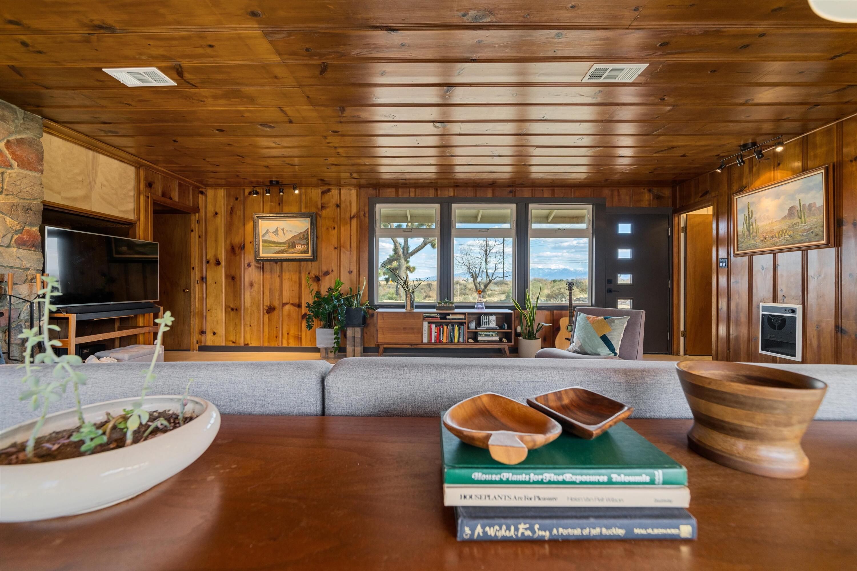 11337 Avenue E E Lancaster Ca East Lancaster, CA 93535 - Photo 27 of 60 a living room with furniture and a flat screen tv
