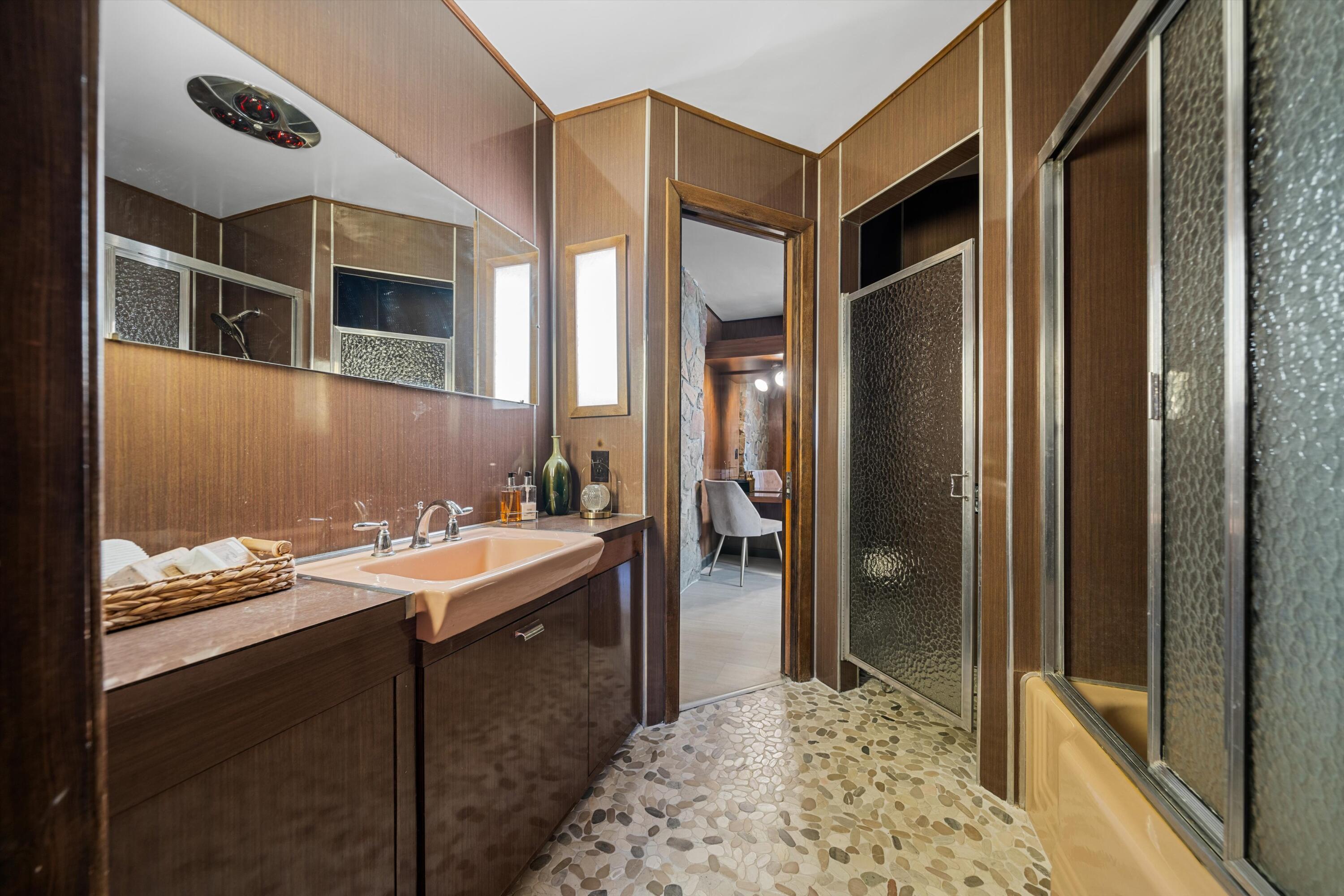 11337 Avenue E E Lancaster Ca East Lancaster, CA 93535 - Photo 35 of 60 a bathroom with a sink and a mirror