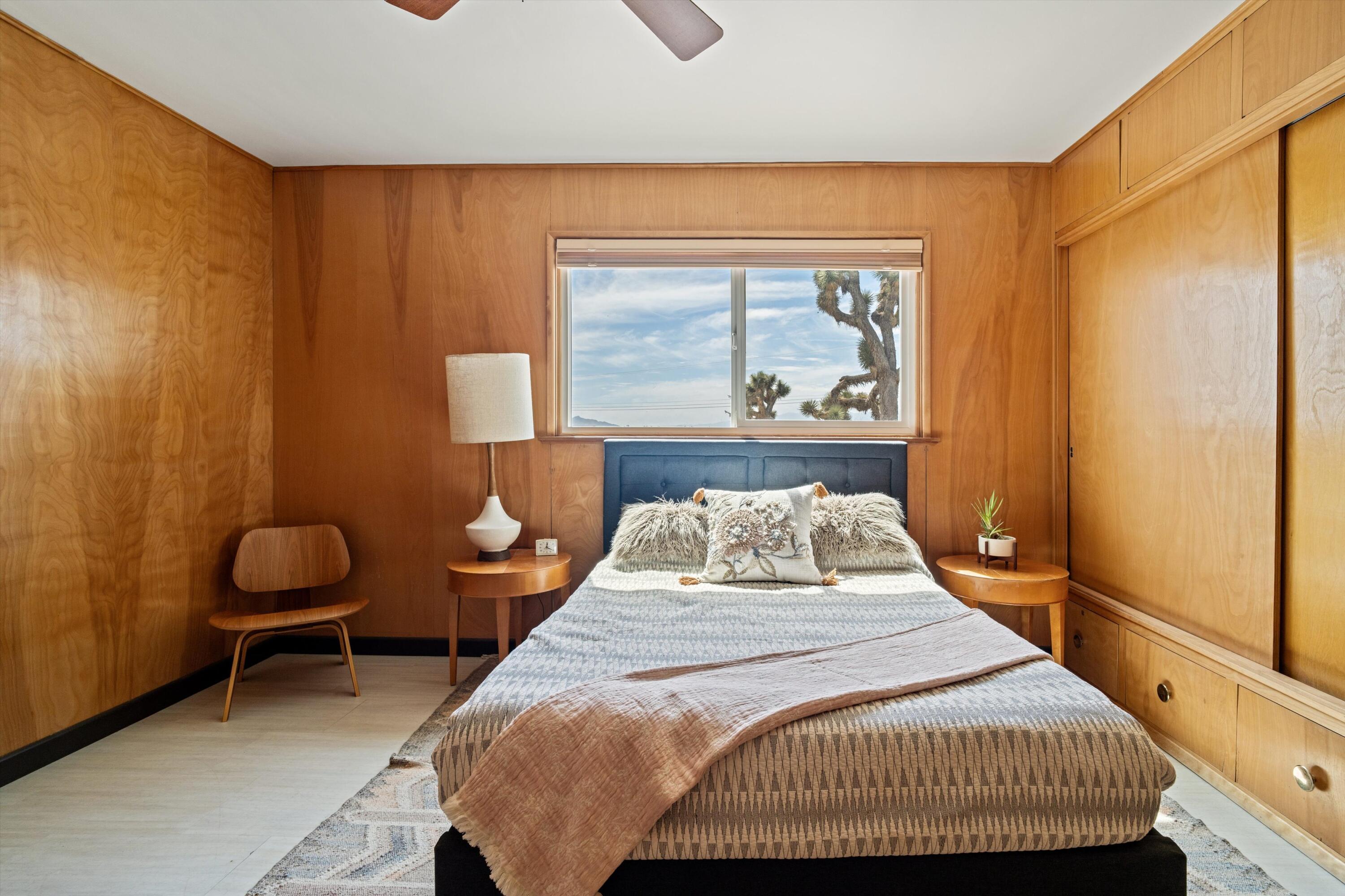 11337 Avenue E E Lancaster Ca East Lancaster, CA 93535 - Photo 38 of 60 a bedroom with a bed and painting on the wall