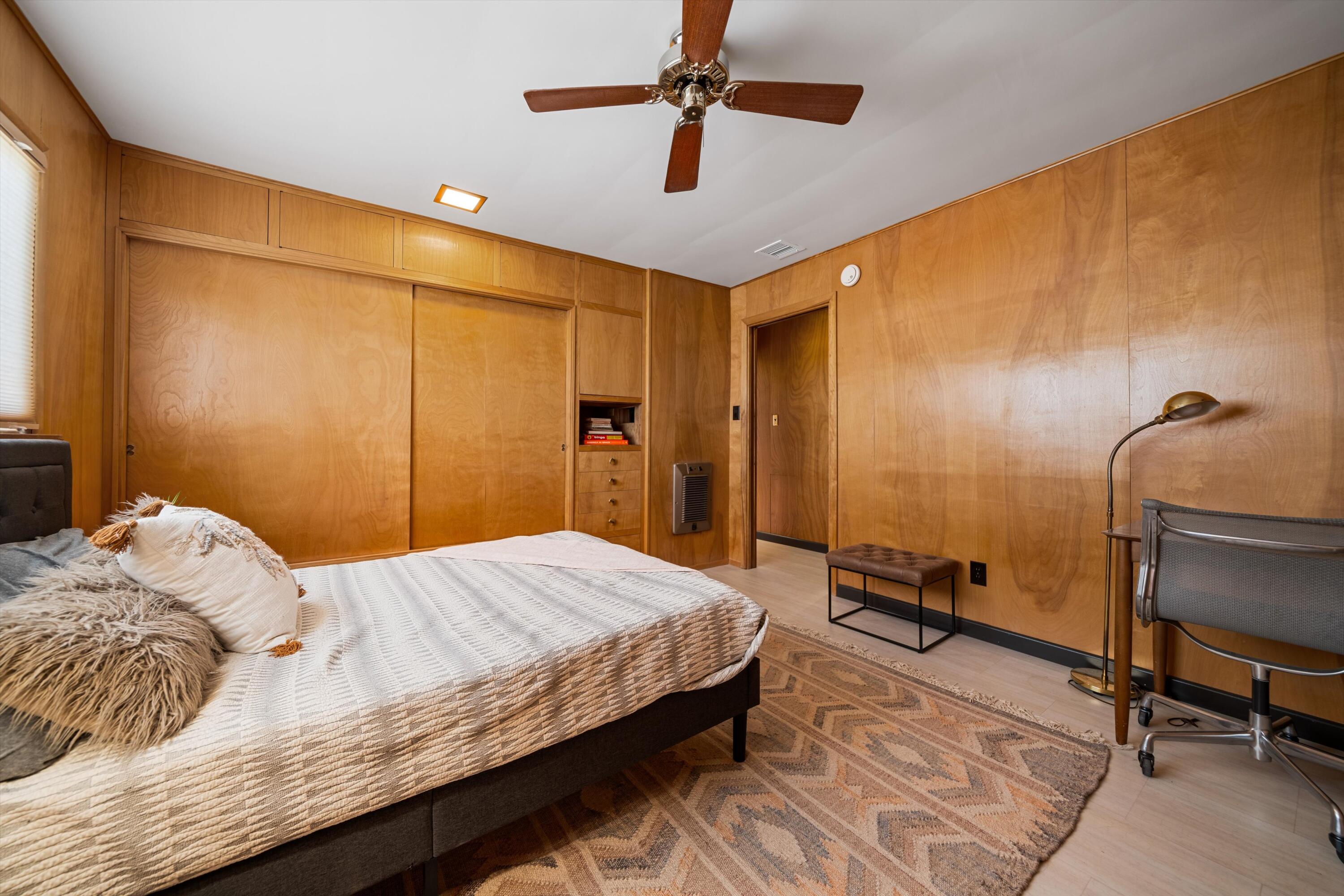 11337 Avenue E E Lancaster Ca East Lancaster, CA 93535 - Photo 39 of 60 a bedroom with a bed and a chandelier