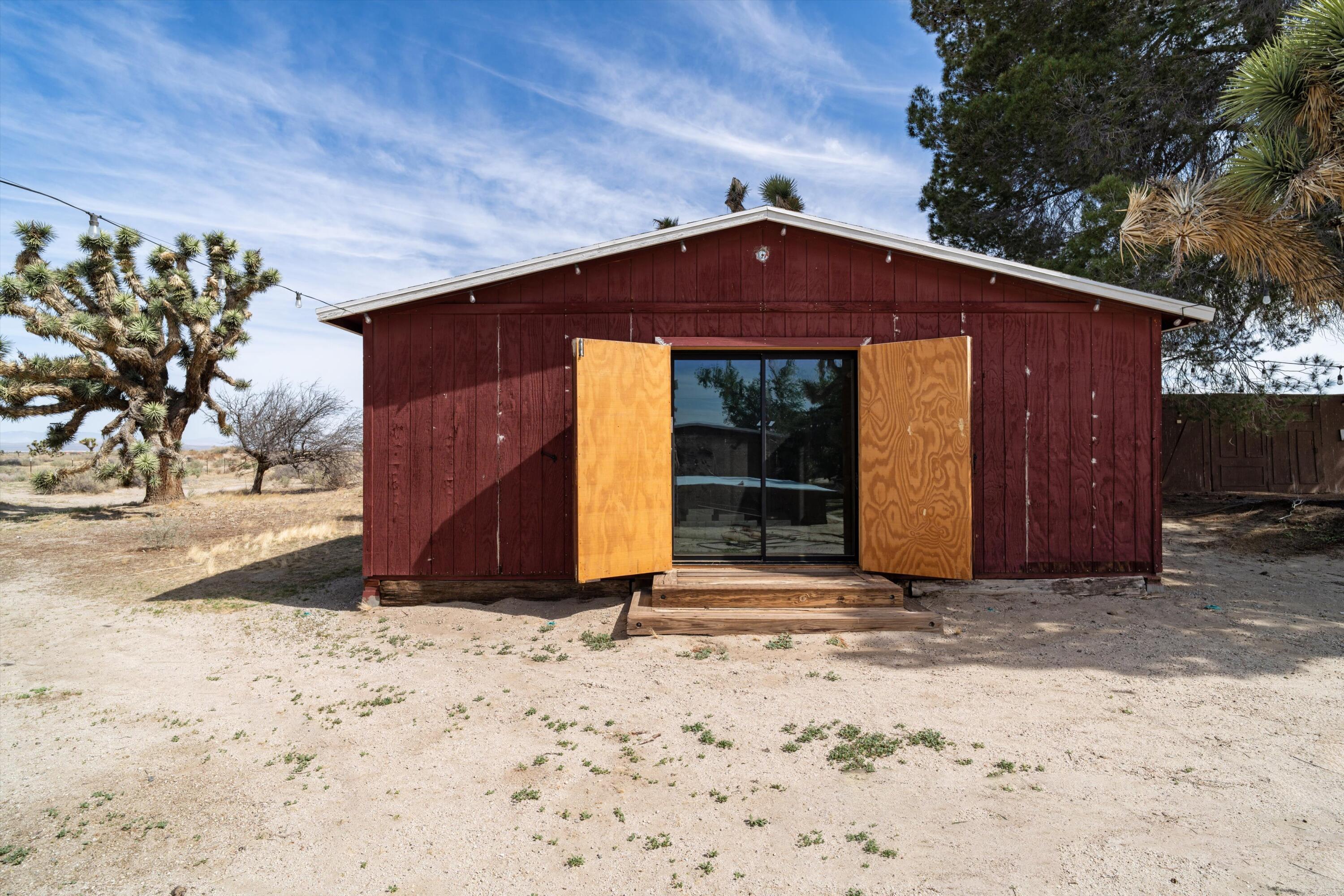 11337 Avenue E E Lancaster Ca East Lancaster, CA 93535 - Photo 43 of 60 a front view of a house with a yard