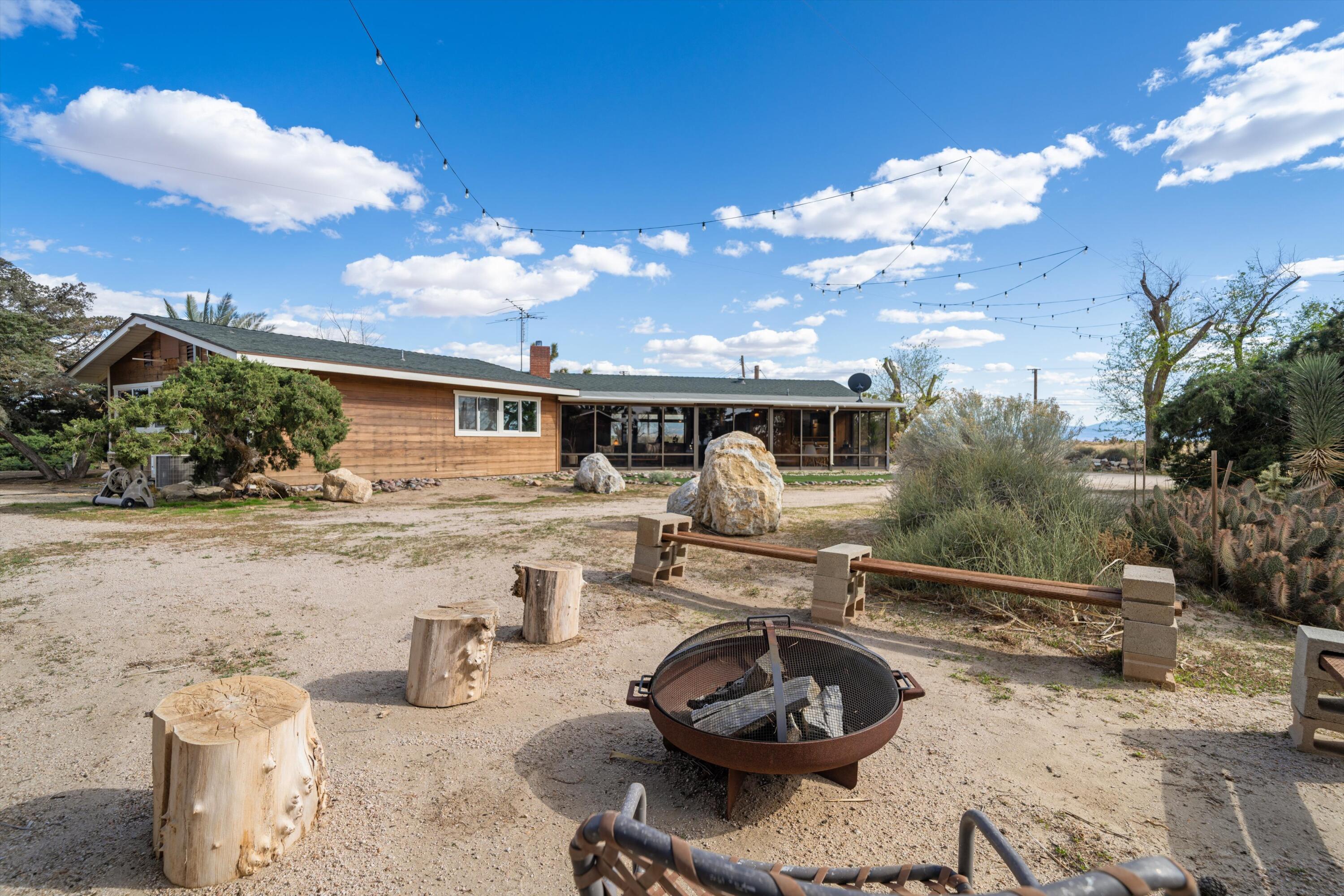 11337 Avenue E E Lancaster Ca East Lancaster, CA 93535 - Photo 47 of 60 a view of a house with backyard and sitting area