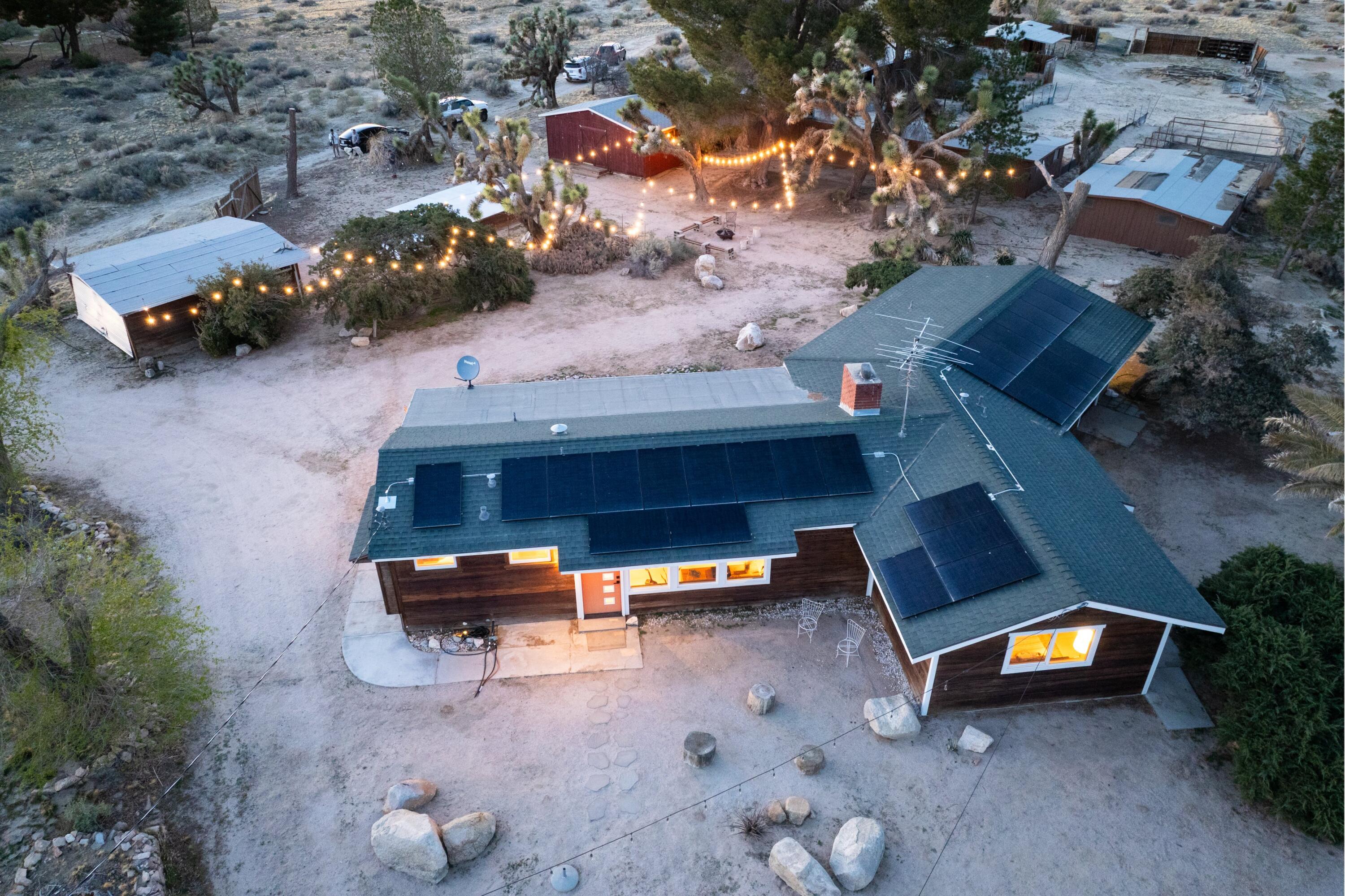 11337 Avenue E E Lancaster Ca East Lancaster, CA 93535 - Photo 55 of 60 an aerial view of a swimming pool with outdoor seating