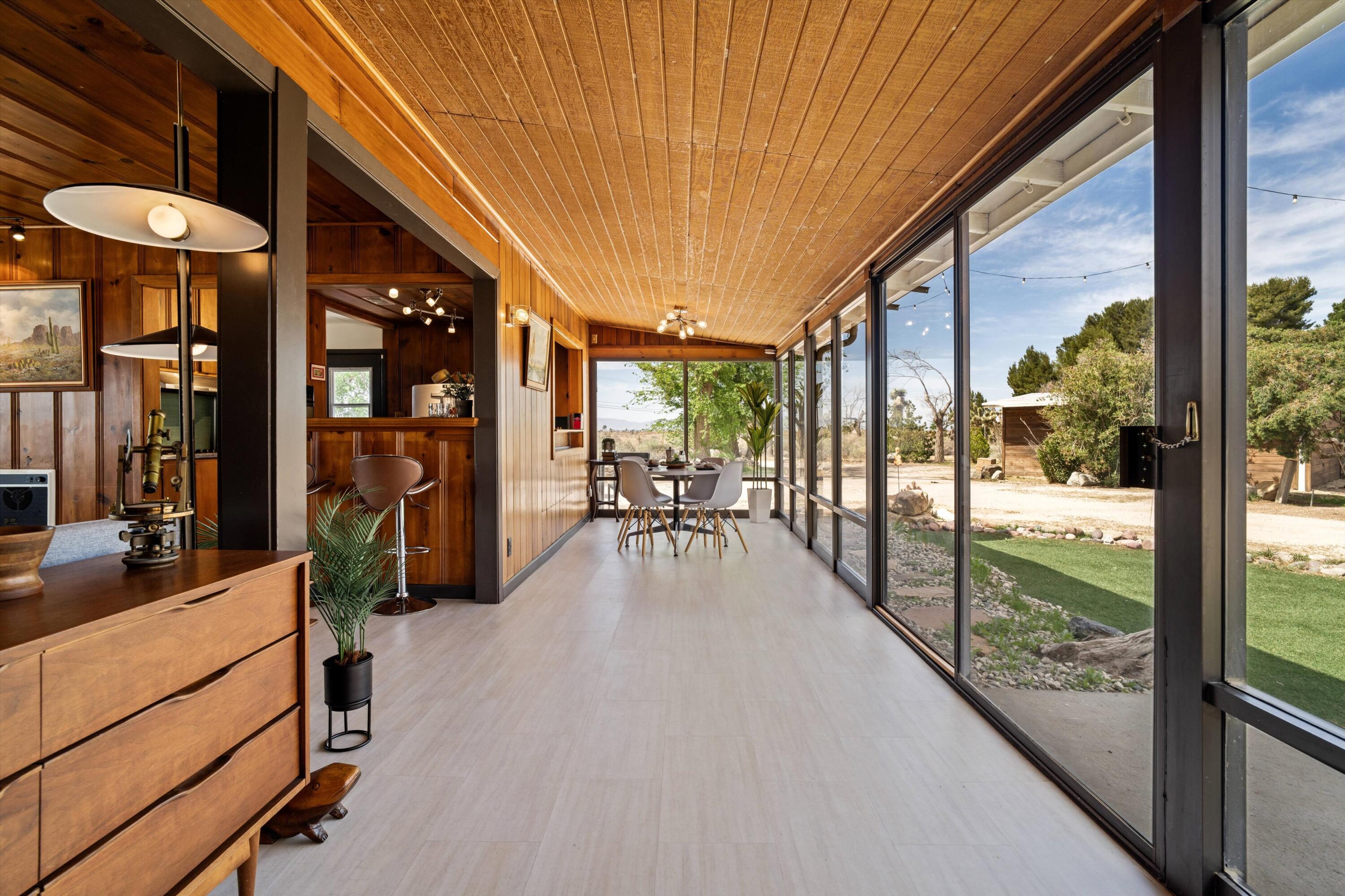 11337 Avenue E E Lancaster Ca East Lancaster, CA 93535 - Photo 6 of 60 a view of a patio with a dining table and chairs