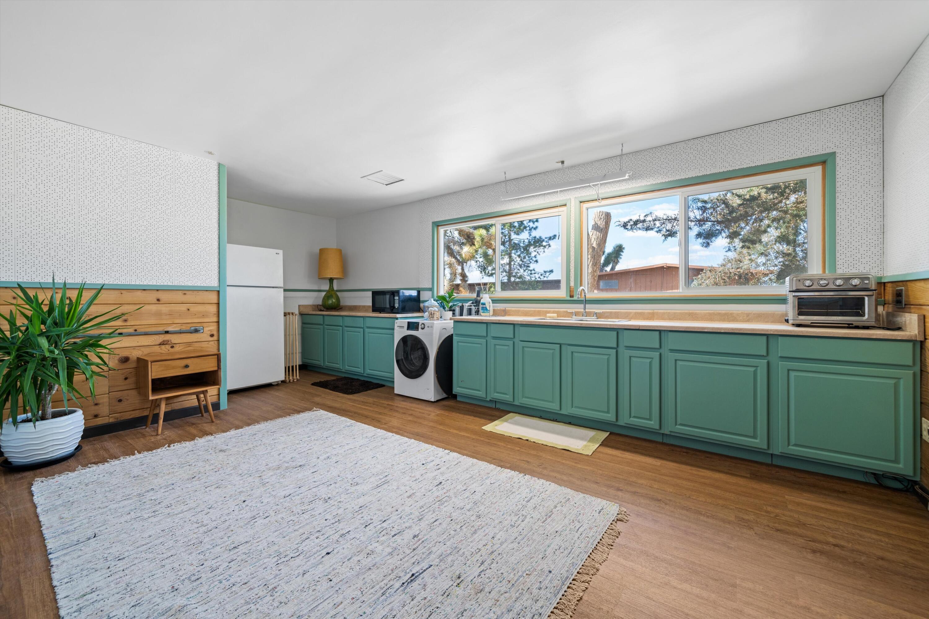 11337 Avenue E E Lancaster Ca East Lancaster, CA 93535 - Photo 8 of 60 a view of a kitchen with furniture and a kitchen