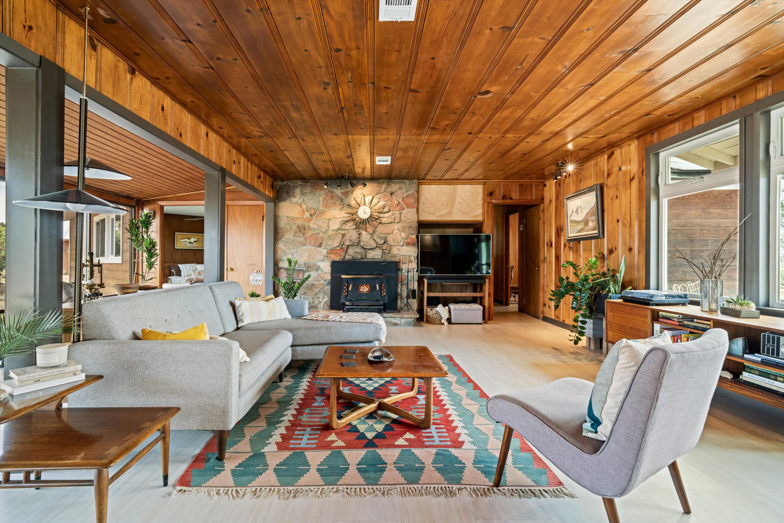 11337 Avenue E E Lancaster Ca East Lancaster, CA 93535 - Photo 10 of 60 a living room with furniture a flat screen tv and a large window