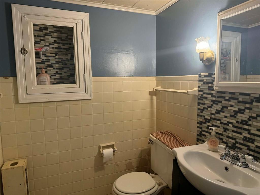27 Legion Street Republic, PA 15475 - Photo 15 of 31 a bathroom with a toilet sink and mirror