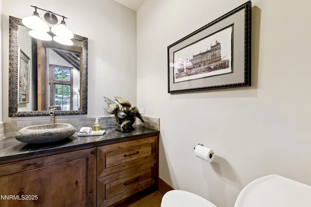 a bathroom with a sink and a window