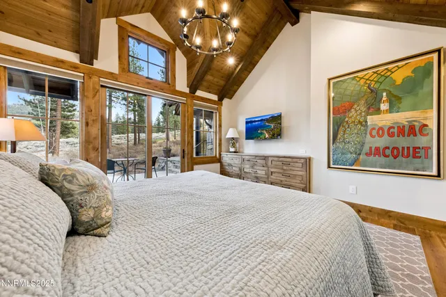 a bathroom with a granite countertop sink and a large mirror
