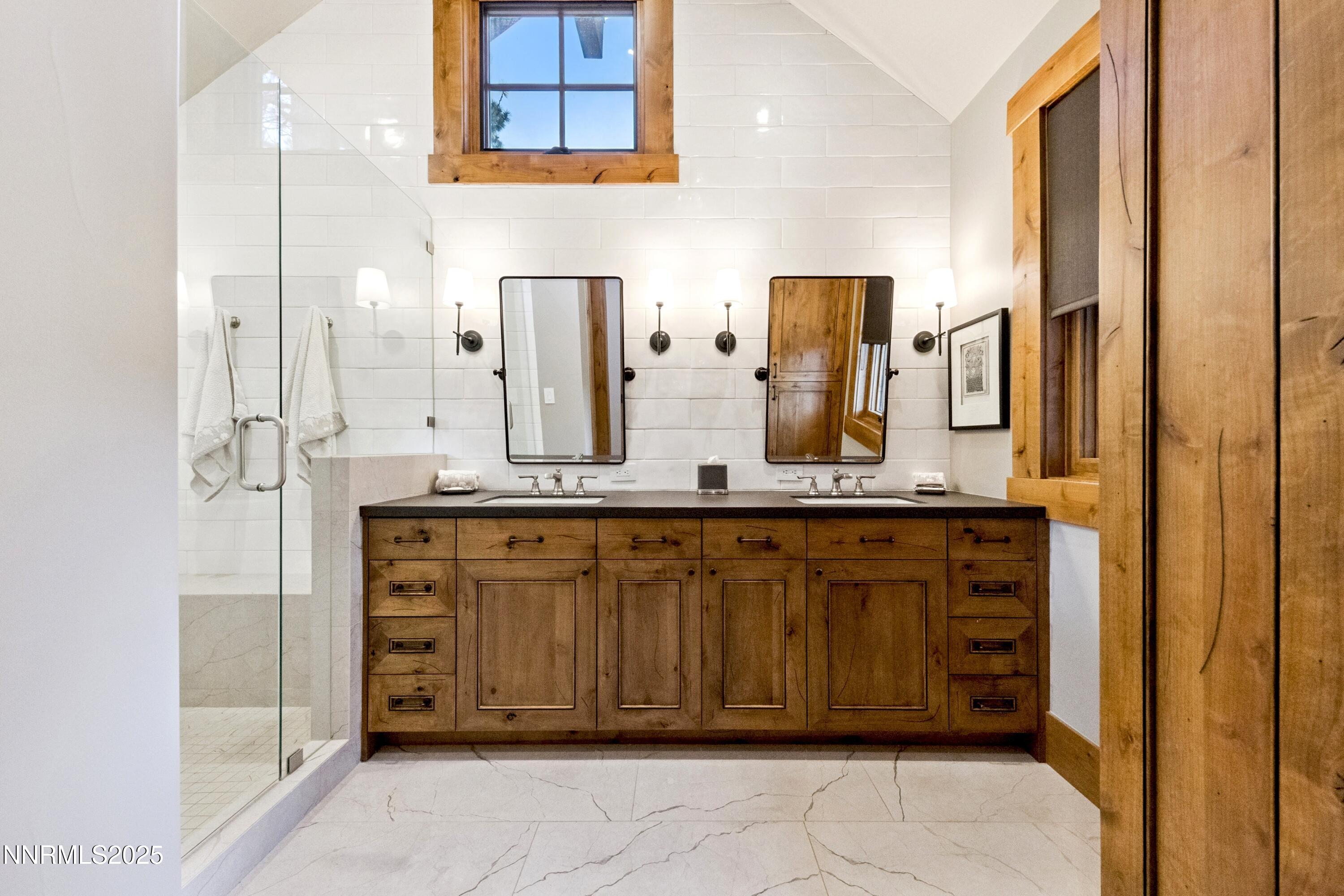 261 Redding Way Carson City, NV 89705 - Photo 31 of 83 a bathroom with a granite countertop sink and a mirror