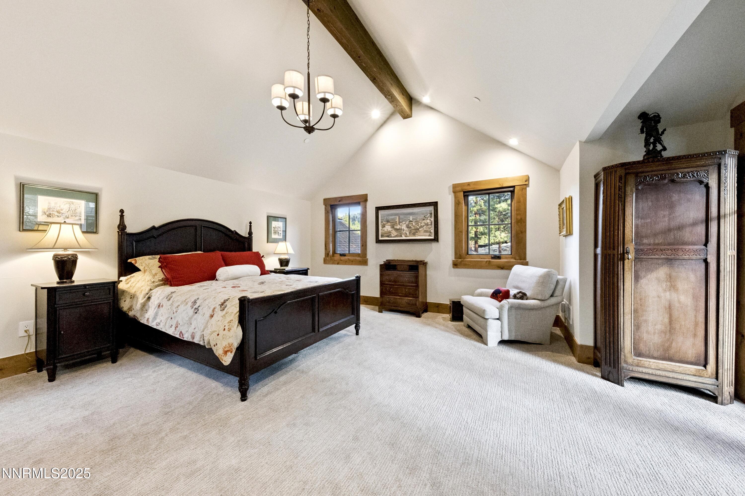 261 Redding Way Carson City, NV 89705 - Photo 37 of 83 a bedroom with a bed couch chandelier and a window