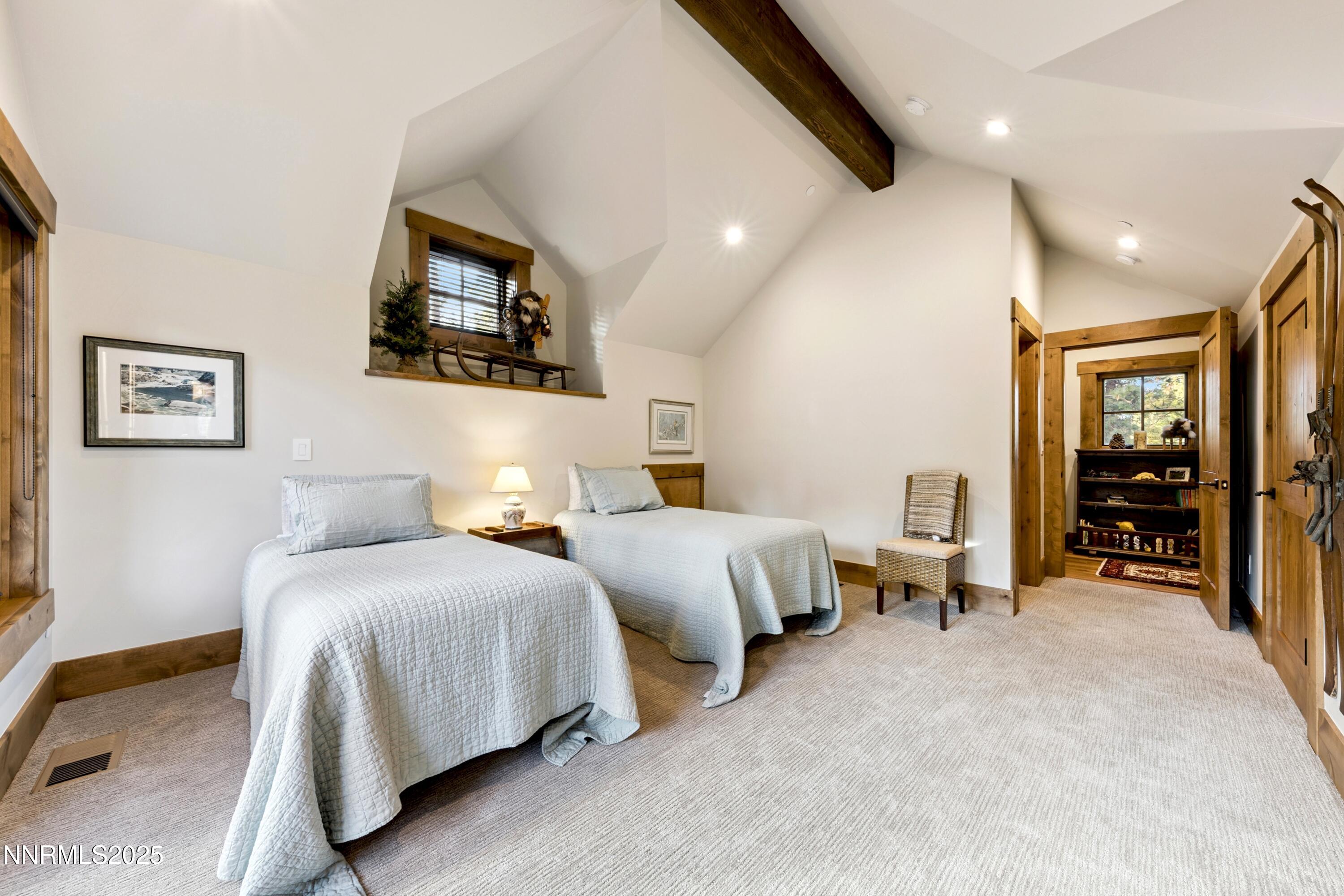 261 Redding Way Carson City, NV 89705 - Photo 42 of 83 a spacious bedroom with two beds and a large mirror