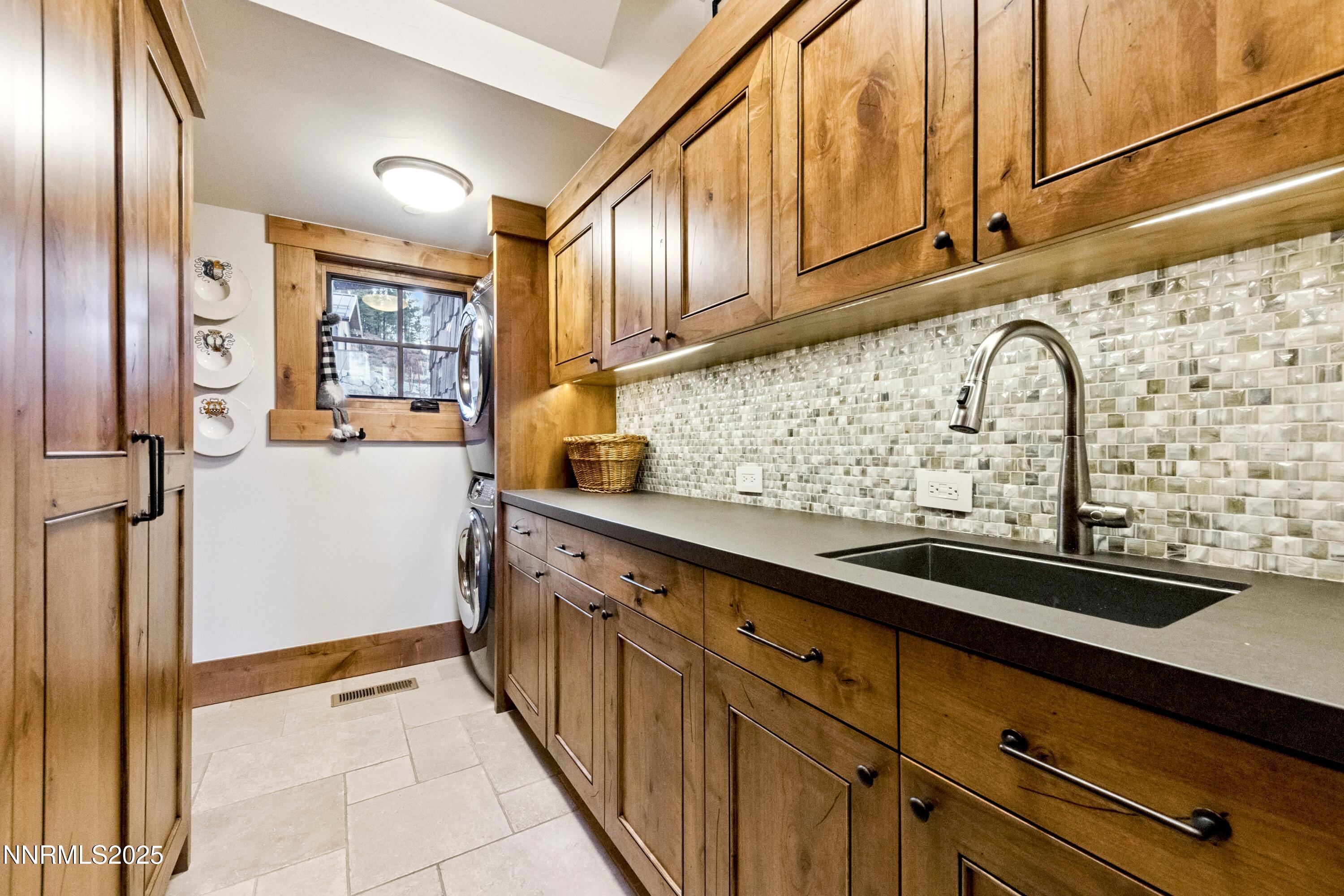 261 Redding Way Carson City, NV 89705 - Photo 51 of 83 a kitchen with stainless steel appliances granite countertop a sink and cabinets