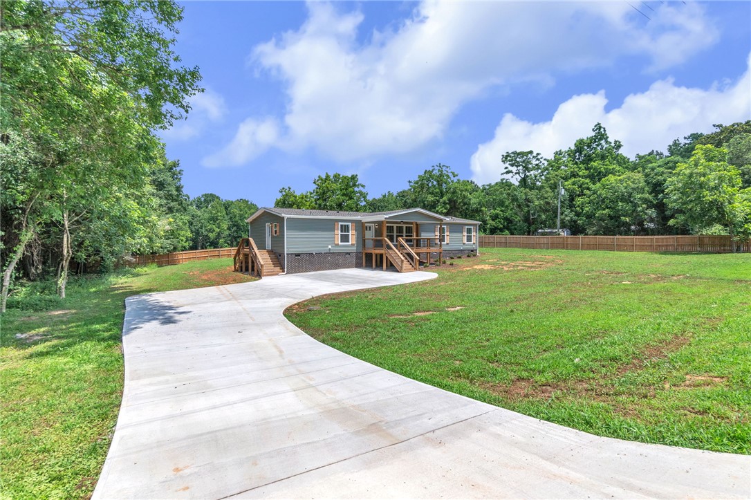 108 Old River Road Iva, SC 29655 - Photo 23 of 31 A newly constructed residence features an inviting front deck and an extensive concrete driveway.