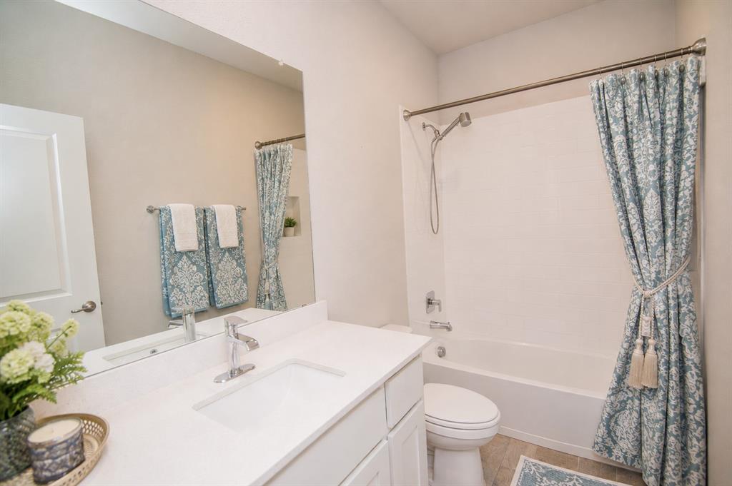 1804 Mensa Drive Haslet, TX 76052 - Photo 21 of 30 Bathroom featuring a white vanity with an integrated sink and light-colored countertop