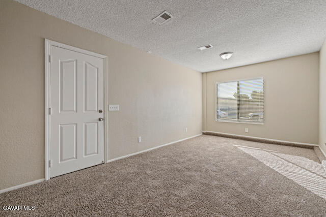 523 East Kettering Street Lancaster, CA 93535 - Photo 14 of 28 a view of an empty room with a window