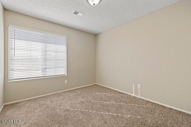523 East Kettering Street Lancaster, CA 93535 - Photo 18 of 28 an empty room with a window