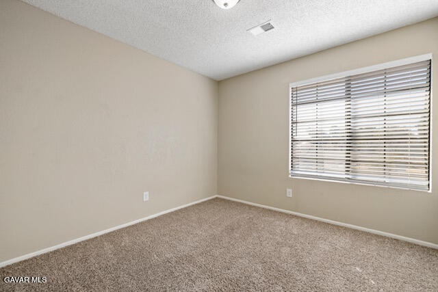 523 East Kettering Street Lancaster, CA 93535 - Photo 19 of 28 an empty room with a window