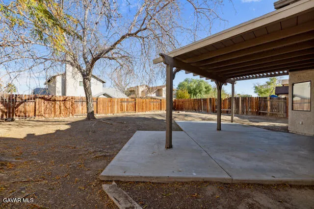 a view of field with tall trees