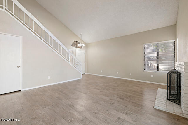 523 East Kettering Street Lancaster, CA 93535 - Photo 4 of 28 a view of an empty room with wooden floor and a window